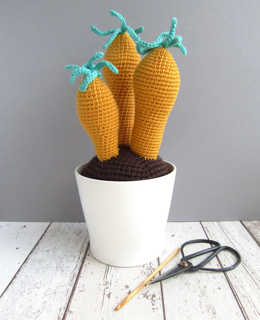 Quirky crocheted plant in mustard and teal